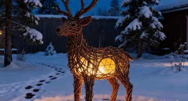 Reindeer lanterns on a snowy night